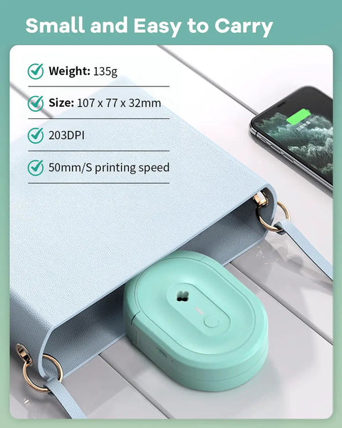 Compact Bluetooth Label Maker With Built In Rechargeable Battery And Ink Free Direct Thermal Printing For Effortless Home Organization And Straight Up Reliable Daily Labeling Jobs In Cool Green placed inside a light blue bag.