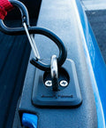 Retractable Truck Bed Tie Down Anchors 2-Pack With Raised Fit OE Texture Top Rail Mount. Installed on blue truck rail