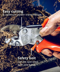 Close-up of Heavy Duty Anvil Pruner For Gardening Beefy Hedge Trimmer And Pruning Shears Handheld Garden Tool in use, cutting roots