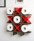 Tic Tac Toe Toilet Paper Holder Stand With Rustic Farmhouse Wood Decor With Vibe, wall-mounted with red Xs and white toilet rolls.