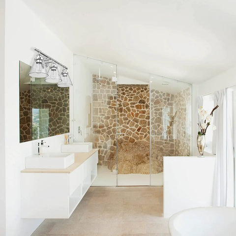 Parker 3-Light Vanity Light in chrome with clear glass shades above modern sink in rustic stone bathroom, 24.63W x 11H inches