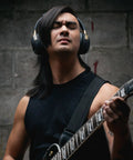 Person playing guitar wearing Spark NEO Wireless Guitar Headphone Amp And AI Powered Guitar Rig For Dope Audio Experience