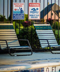 Two Pack Pool Safety Signs Bundle 14x10 Outdoor Pool Signs Stay Safe By The Pool Watch Your Kids Swim At Your Own Risk Weatherproof 0.040 Aluminum Easy To Mount Durable For Backyard Pools PSP-2403 installed on fence