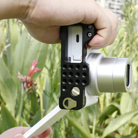 L-Shaped Grip For Sony ZV-1 II And ZV-1F Vlog Cameras With Black ARCA Extension Bracket and Quick Release Plate in handheld use