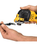 Hand holding Oscillating Multi Tool Kit With 3 Amp Motor Dual Grip Variable Speed Trigger Quick Change System blade attachment