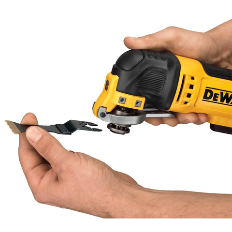 Hand holding Oscillating Multi Tool Kit With 3 Amp Motor Dual Grip Variable Speed Trigger Quick Change System blade attachment