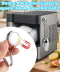 Heavy Duty Stainless Steel Ice Scoop with Magnetic Hook attached to a metal surface in a kitchen setting