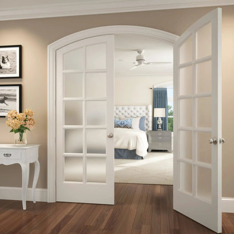 Bedroom And Bathroom Privacy Door Knob Lock In Satin Nickel Finish on white French doors opening to a bedroom.