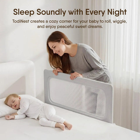 Woman adjusts 47 Inch Toddler Bed Rail Foldable Baby Guard Built For Safer Sleep And Calm Nights Snug No Gap Mattress Fit