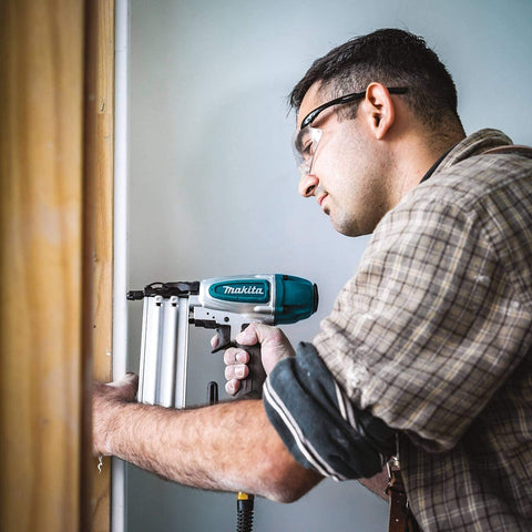 Person using Renewed 18 Gauge Pneumatic Brad Nailer For DIY Pros, Drives Nails From Five Eighths To Two Inches, in action