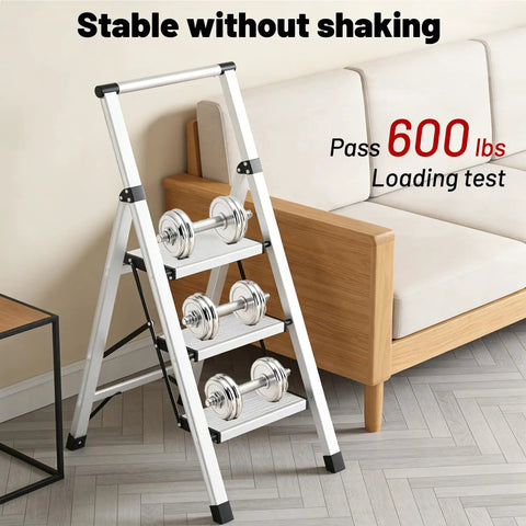 Ultra Lightweight Aluminum 3 Step Ladder Folding Stool With Safety Handrail Heavy Duty 600 Pound Capacity Anti Slip Pedals Slim Fold Design For Home Use And Everyday DIY Projects, shown with dumbbells in a living room