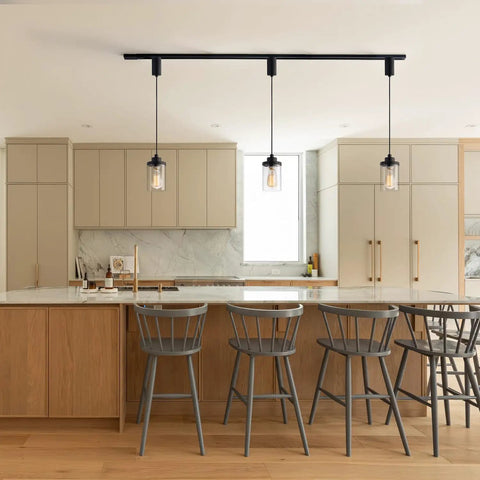 Slick Adjustable Black Track Lighting Pendants Pack Of 3 illuminating modern kitchen with clear glass shades.