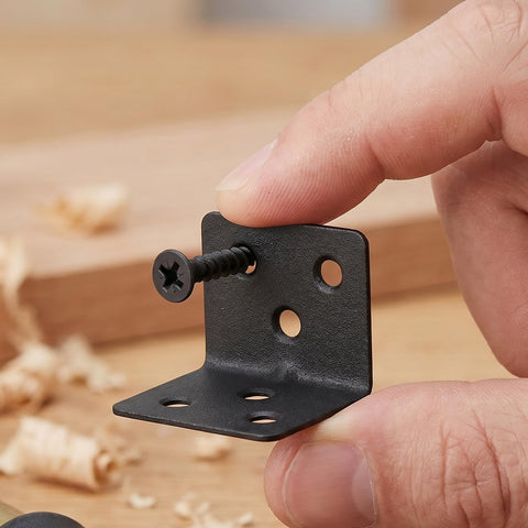 Close-up of 12 Pack L Shape Corner Braces With Screws Heavy Duty Cold Rolled Steel 90 Degree Shelf Supports held by hand