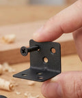 Hand holding 12 Pack L Shaped Corner Brackets With Screws For Shelves And Cabinets 90 Degree Right Angle Shelf Braces Built Beefy From Cold Rolled Steel