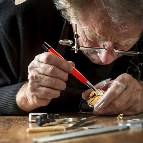 Person using Drilling Cleaning Pen With Fiberglass Brush And Precision Abrasive Stick For Clock Gear Jewelry And Watch Repair Dust Removal