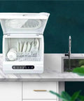 Compact Kitchen Workhorse Smart Countertop Dishwasher Automatic Tabletop Cleaner with dishes and glassware on counter.