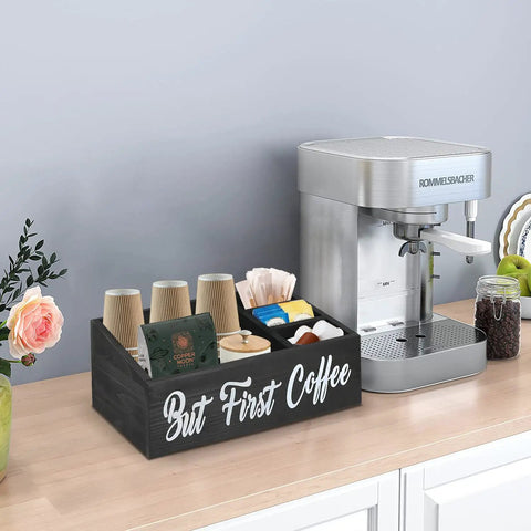 Boss Farmhouse Style Coffee Station Organizer with four compartments on countertop next to coffee machine, holds pods and cups.
