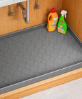 Under Sink Waterproof Silicone Cabinet Mat 34 Inch by 22 Inch, Thick Edge Protector for Kitchen and Bathroom installed view.