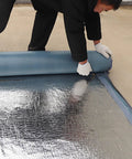Premium Ultra Heavy Duty Self Adhesive Waterproof Roof Patch Tape For Asphalt Shingles And Leaks Hella Tough being rolled out for application.