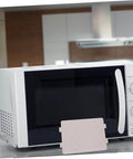 Microwave Waveguide Cover Mica Sheet Heat Insulation Guard in front of microwave oven, cuttable replacement part displayed