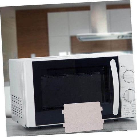 Microwave Waveguide Cover Mica Sheet Heat Insulation Guard in front of microwave oven, cuttable replacement part displayed
