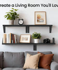 Straight Up Sleek Wall Mounted Floating Shelves In Matte Black Solid Set Of Four above a gray couch with books and decor.