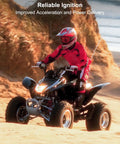 Person riding ATV in sand dunes with Reliable Ignition text above