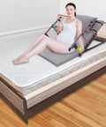 Heavy Duty Electric Lifting Backrest For Bed With 2-80° Power Adjustment And Massive 661 Lb Capacity Featuring Remote Control, Foldable Armrests, Built-In Pillow, and Comfortable Footrest Assembly For Ultimate Sitting Support in use on a bed.