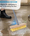 Long Handled Floor Scrubber Brush With 52 Inch Reach For Decks, Showers, Bathrooms, Boats, Concrete, Carpets And Garages, Stiff Bristles Scrub Tough Grime, Soap Scum, And Dirt Without Scratching Surfaces, shown on wet concrete floor with 45-degree tilt