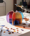 Next Level Stained Glass Soldering Jig With 3D Cactus Mold Template, showcasing colorful glass pieces on a white workbench.