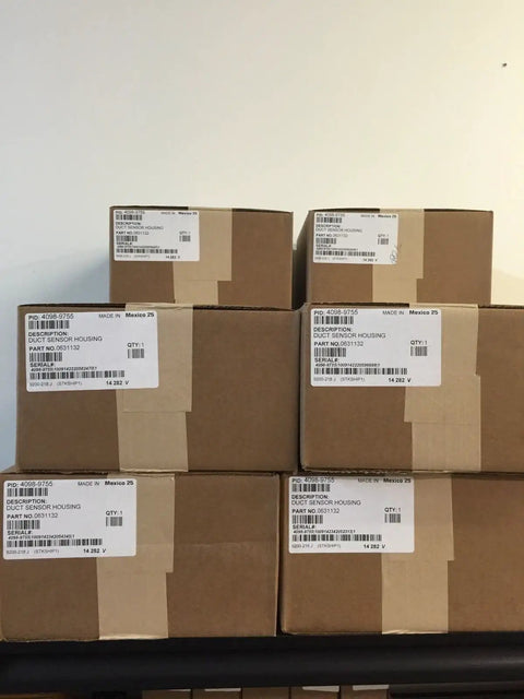 Stack of boxed Duct Sensor Housing 4098-9755 for Fire Safety Systems, labeled packages ready for shipping.