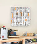 Two Pack 12 By 24 Inch Metal Pegboard Panels For Garage Wall Storage And Tool Organization On Workbench Or In The Workshop Grey Durable Steel Panels With Wide Hook Compatibility For Pegs And Accessories mounted on a workshop wall.