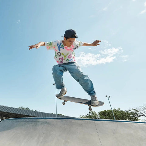 Skateboarder performing trick with Skateboard Truck Bushings 2 Pack 90A PU Longboard Rebuild Kit for smooth street rides