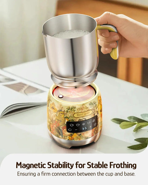 Detachable Milk Frother With Four Temperature Settings Delivers Barista Style Foam For Hot Or Cold Drinks Five In One Frothing And Heating Options Dishwasher Safe 400ml Perfect For Latte Cappuccino Hot Chocolate, showing a stainless steel cup on a decorative base