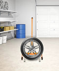 Beefy Heavy Duty Tire Dolly For Garage And Auto Repair Wheel Tire Moving Cart with steel frame in a garage setting