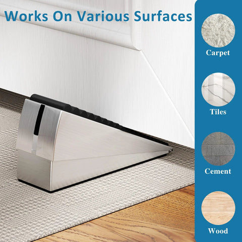 Brushed metal door stopper wedge with adjustable spring, 3-inch tall, placed at door bottom on carpet.
