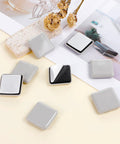 Heavy Duty Self Adhesive Furniture Sliders 12 Pack Quick Stick Eva Foam Moving Pads on display with peel-off backing.