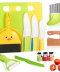 Toy 14-piece kid's kitchen knife set; yellow duck-shaped holder, colorful plastic knives, cutting board and peeler.