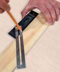 Hand using Straight Shooter Nine In One Measuring And Marking Tool Featuring Dual Levels Sliding Bevel for precise marking.