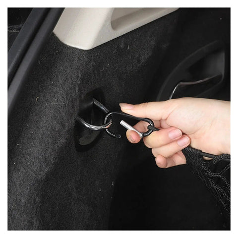 Lock Down Your Gear With This Durable Rear Trunk Cargo Net Adjustable Pickup Tailgate Storage Restraint Heavy Duty Bungee Mesh Organizer Secure Hooks Buckles Ideal For Tesla Cybertruck 2024 Plus, showing hook attachment in trunk.