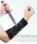 Solid Cut Resistant Forearm Sleeves With A Grippy Nonslip Fit And Thick Reinforced Seaming Built To Dodge Splinters And Scratches On Rough Worksites Or Weekend Garden Projects Reliable Armor That Stays Locked In Wherever You Hustle, shown protecting forearm against a knife.