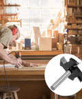 Man using CNC Spoilboard Surfacing Router Bit With 1/4 Inch Shank, Extra Large 1-1/2 Inch Cutting Diameter For Slab Flattening in a workshop.