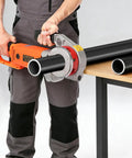 Rugged Portable Electric Pipe Threader 2300W All Copper Motor in use on black pipe with worker gripping tool.