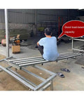 No Sweat Gravity Roller Unloading Ramp With Durable Steel Frame And Smooth ABS Tracks, six bay conveyor rig in warehouse.