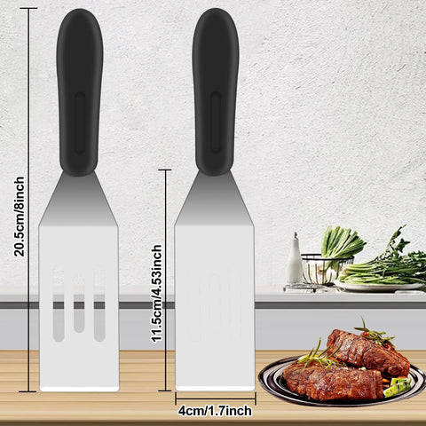Two-piece stainless steel slotted spatula set with black handles for kitchen use, front view