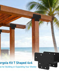 Three Way T Bracket Pergola Kit For 4x4 Wood Beams shown in beach setting, black steel brackets on wooden structure.