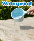 Demonstrating waterproof beige 14x14 sun shade sail canopy with water being poured to show resistance for patio