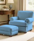 Comfortable blue chair and ottoman set in a stylish living room, showcasing a cozy interior with elegant decor.
