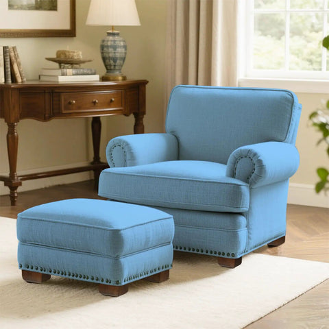 Comfortable blue chair and ottoman set in a stylish living room, showcasing a cozy interior with elegant decor.