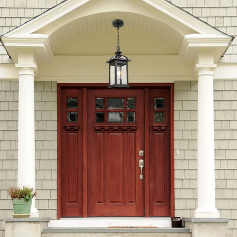 Weatherproof Outdoor Pendant Lantern In Black With Seeded Glass hanging on porch entryway, rust proof and IP65 rated, 13.6 inch tall.